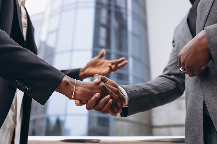Business partners shaking hands